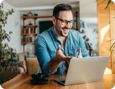 Smiling man using laptop for insurance quote
